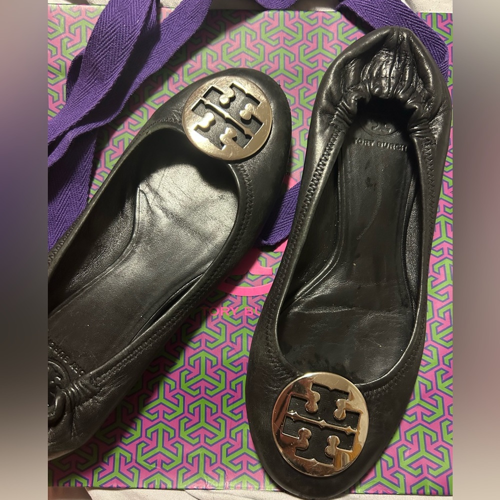 Tory Burch black leather with silver hardware. With shopping bag.